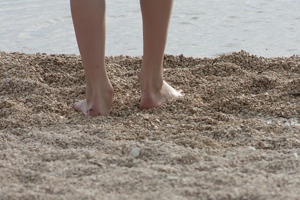 Walking along beach stones - a natural foot reflexology